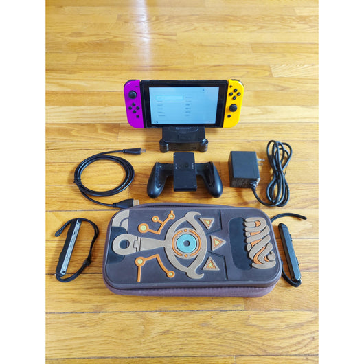 Nintendo Switch console with accessories on a wooden surface