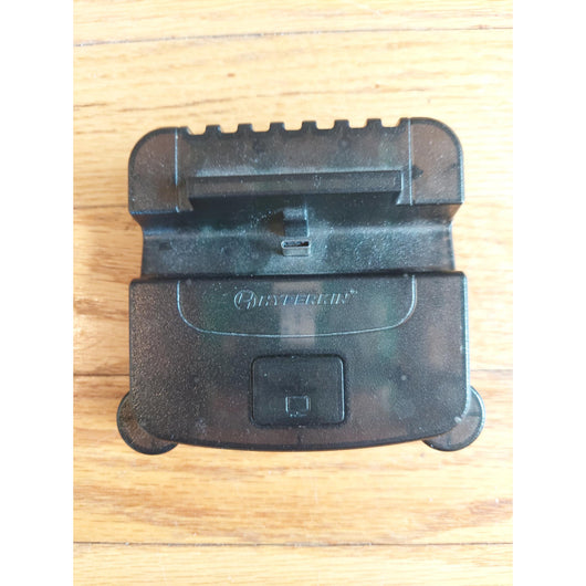Nintendo Switch console with accessories on a wooden surface
