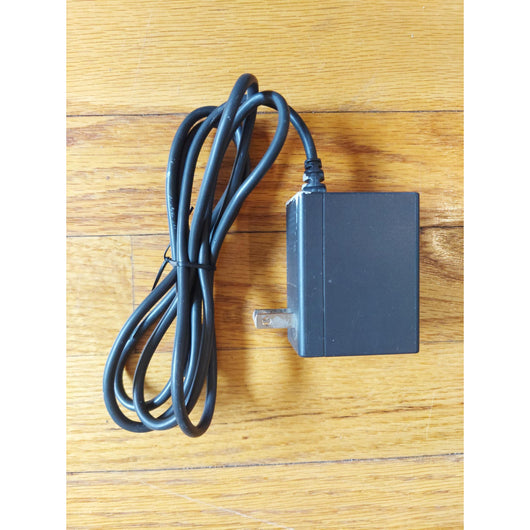 Nintendo Switch console with accessories on a wooden surface