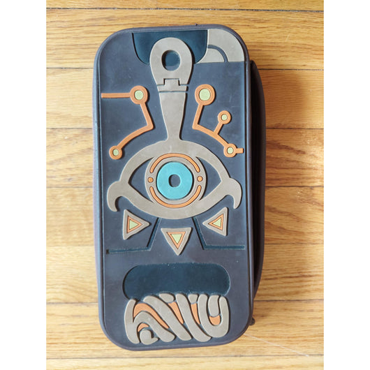 Nintendo Switch console with accessories on a wooden surface