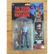 Action figure in packaging with 'The Texas Chainsaw Massacre' BBQ Slaughter Cook
