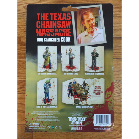 Action figure in packaging with 'The Texas Chainsaw Massacre' BBQ Slaughter Cook