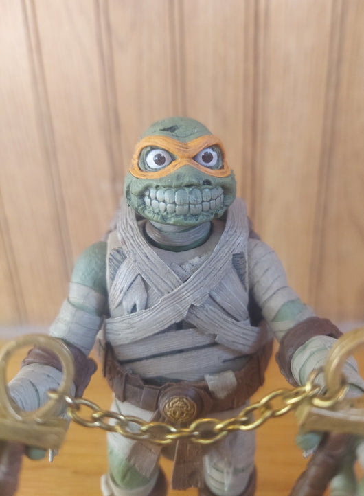 NECA Teenage Mutant Ninja Turtles/Universal Monsters: Michaelangelo As The Mummy