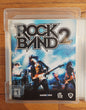 PS3 Rock Band Bundle W/Wired Drum Set, Kick Pedal, Drum Sticks, Wireless Fender