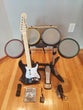 PS3 Rock Band Bundle W/Wired Drum Set, Kick Pedal, Drum Sticks, Wireless Fender