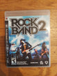 PS3 Rock Band Bundle W/Wired Drum Set, Kick Pedal, Drum Sticks, Wireless Fender