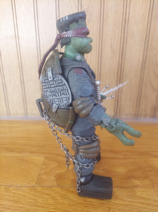 NECA (2021) Teenage Mutant Ninja Turtles/Universal Monsters Raphael Frankenstein